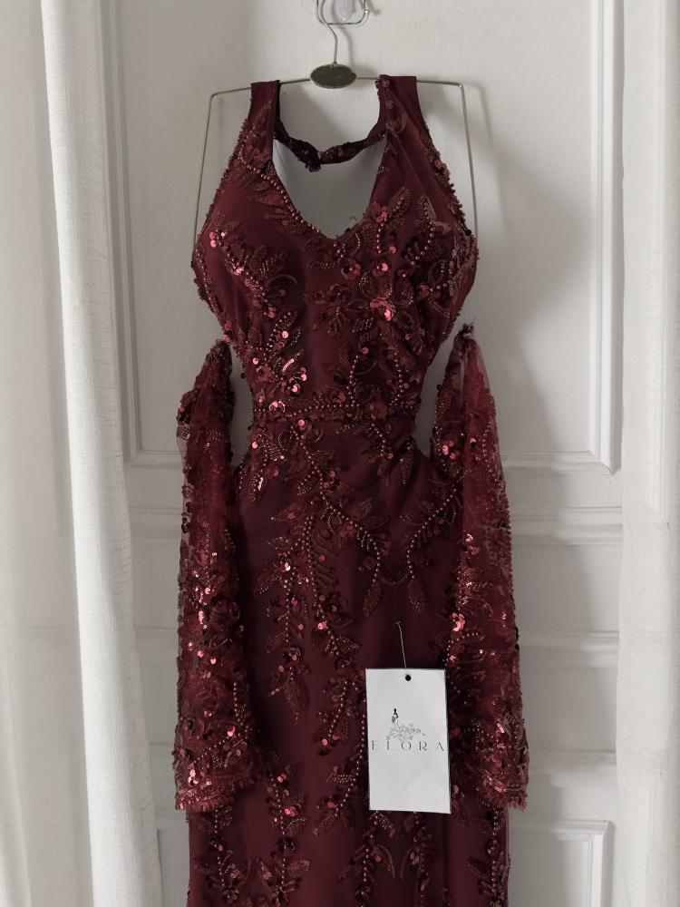 A maroon evening dress with elegant embroidery