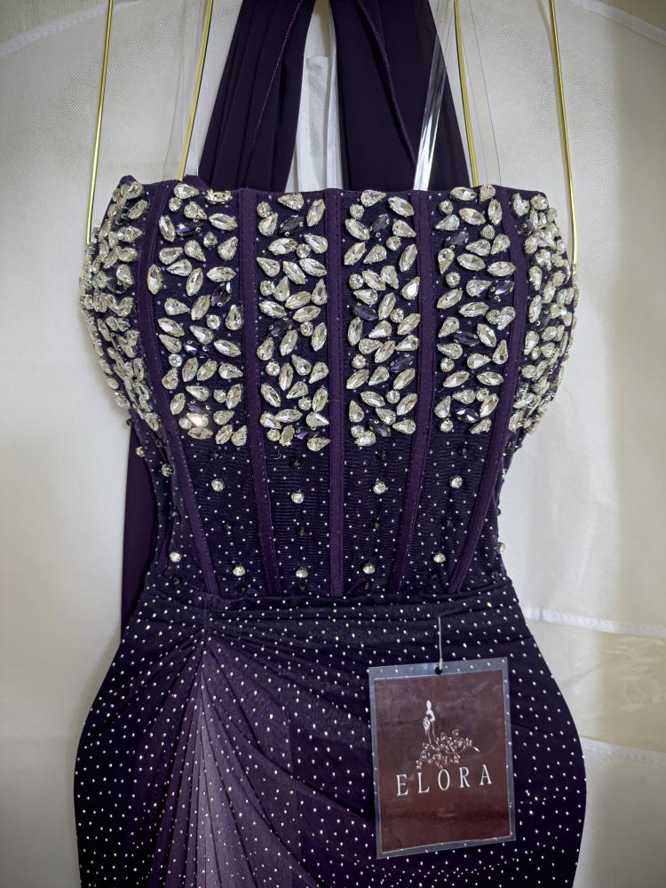 A shiny purple dress with embroidery
