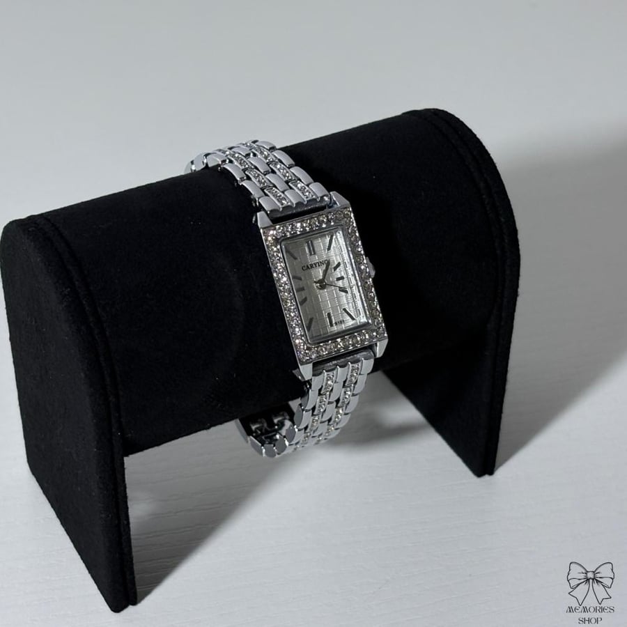 A soft silver wristwatch