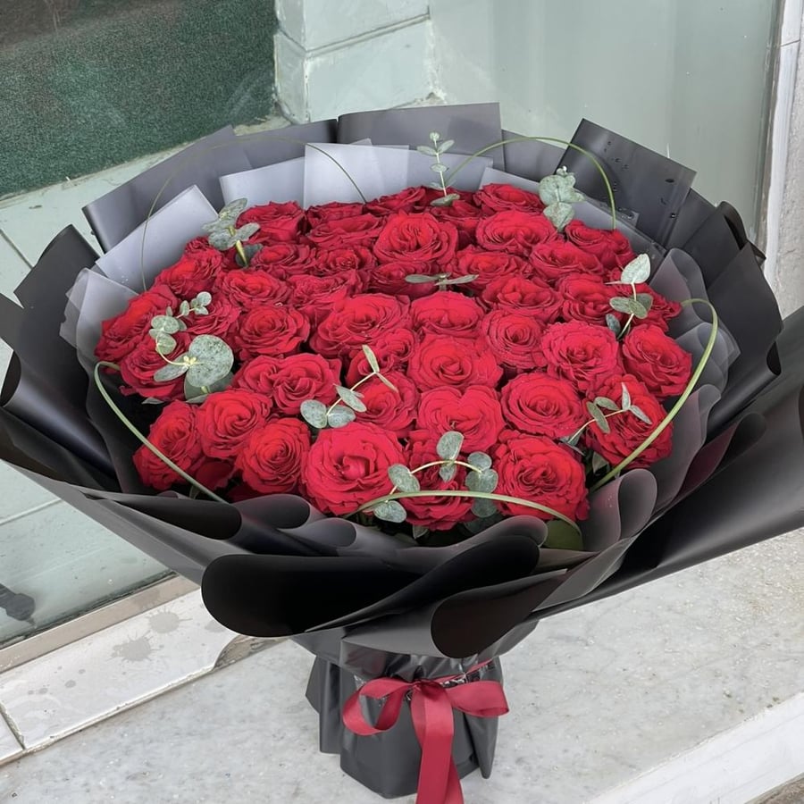 Red bouquet with black wrapping
