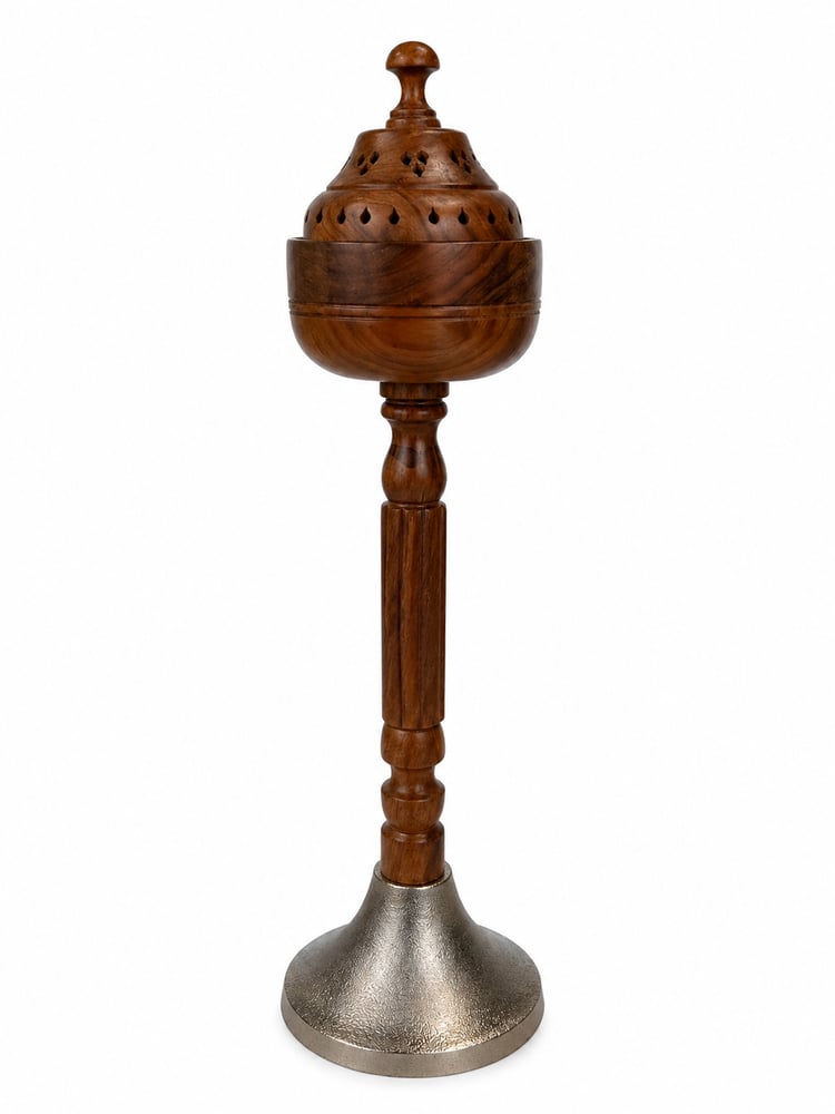 Wooden incense holder in the middle with a silver base