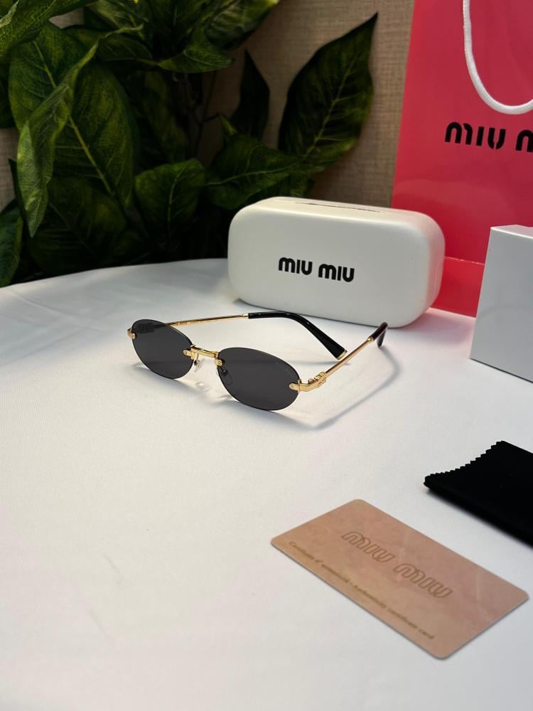 نظارة miu miu أطار ذهبي عدسة أسود
