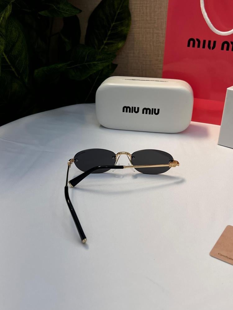 نظارة miu miu أطار ذهبي عدسة أسود