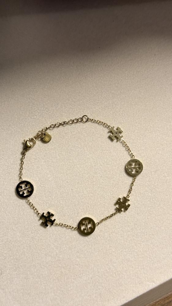 إسوارة TORY BURCH معدن ذهبي بفصوص
