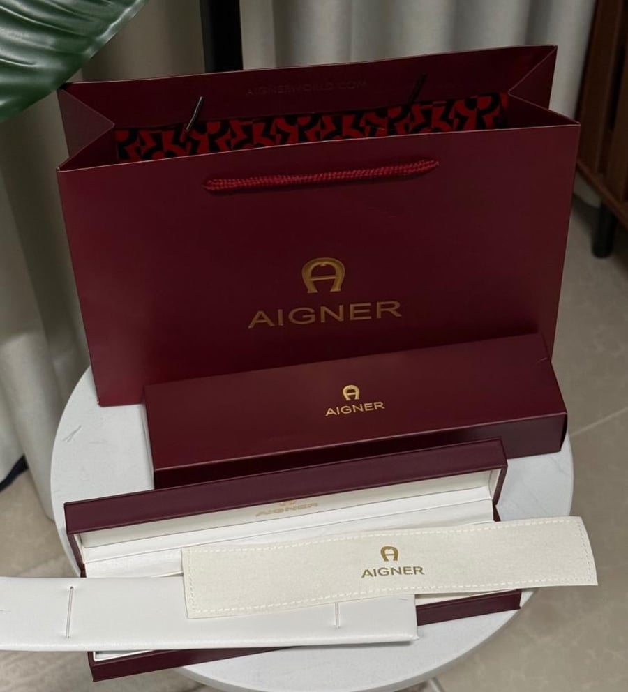 طقم إكسسوارات AIGNER - طقم - أقنر ذهبي وردي ( سلسال - اسوارة - حلق )
