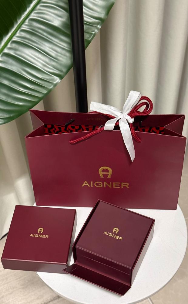 طقم إكسسوارات AIGNER - طقم - أقنر ذهبي وردي ( سلسال - اسوارة - حلق )