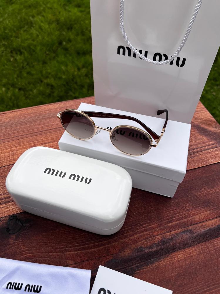 نظارة miu miu أطار بني غامق - عدسة بني مدرج