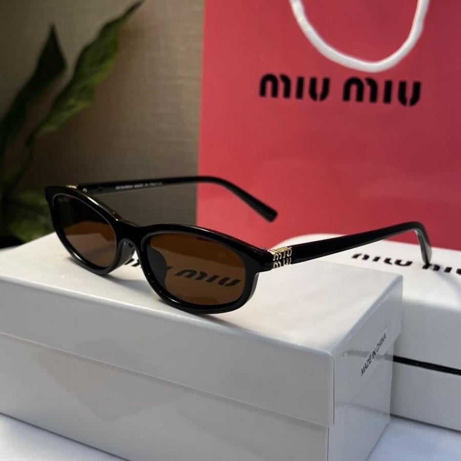نظارة MIU MIU نظارة miu miu إطار أسود عدسة بني