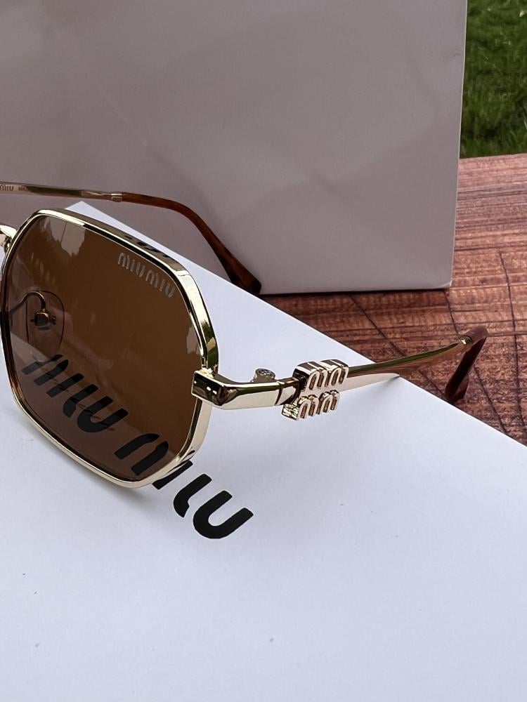 نظارة miu miu أطار ذهبي طرف تايقر - عدسة بني