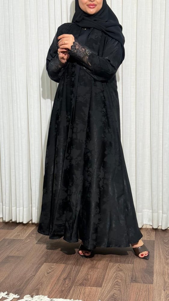 The soft jacquard fabric and sleeves of French lace