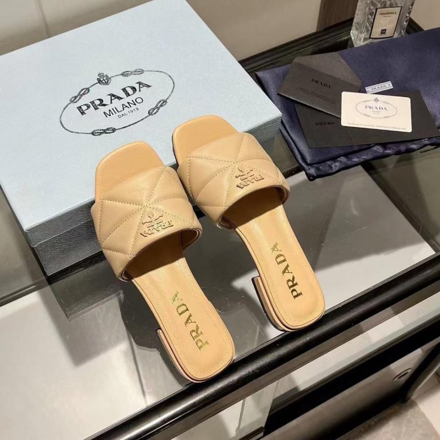 Boots and Prada sneakers