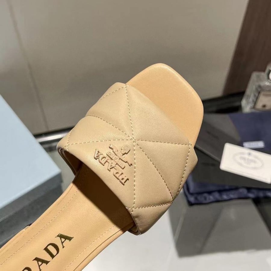 Boots and Prada sneakers