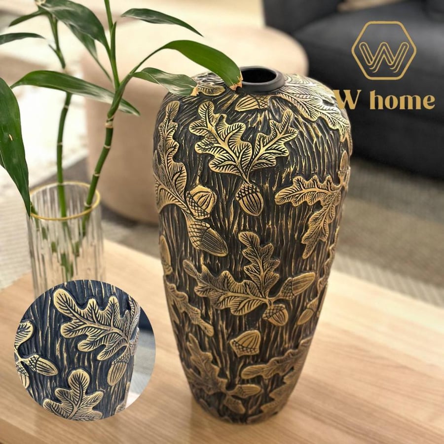 Black vase with golden engravings