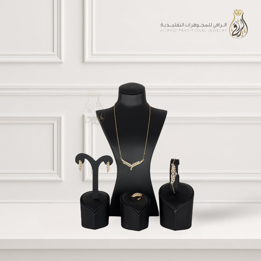 A set with sparkling stones in a winged design