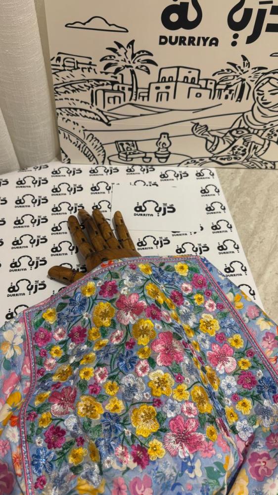 Luxury women's embroidered fabric with a vibrant design decorated with hand embroidery
