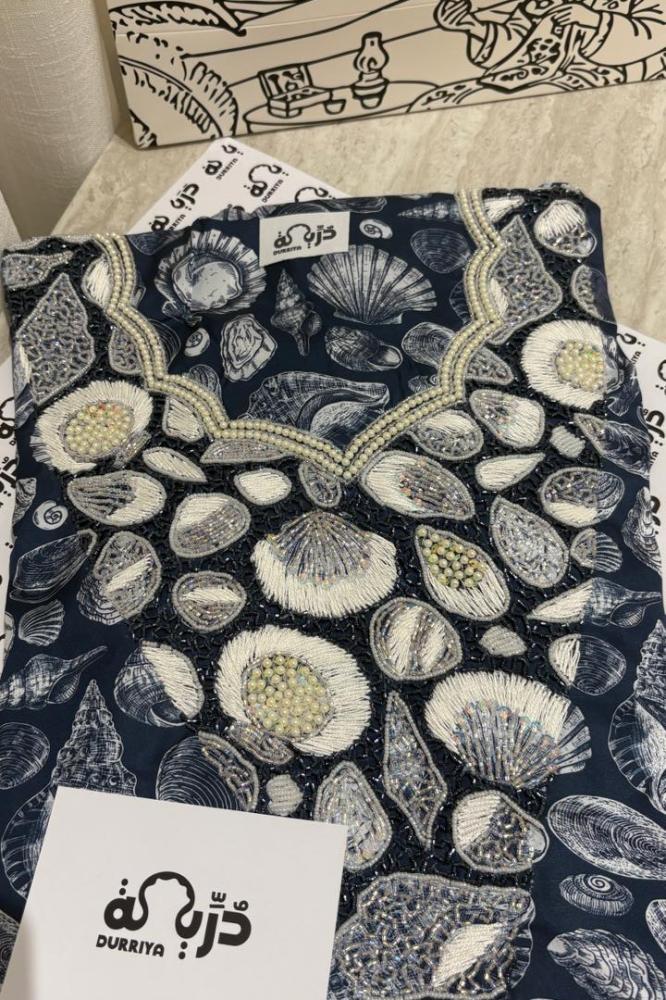 Luxurious fabric of embroidered fabric with inspired details