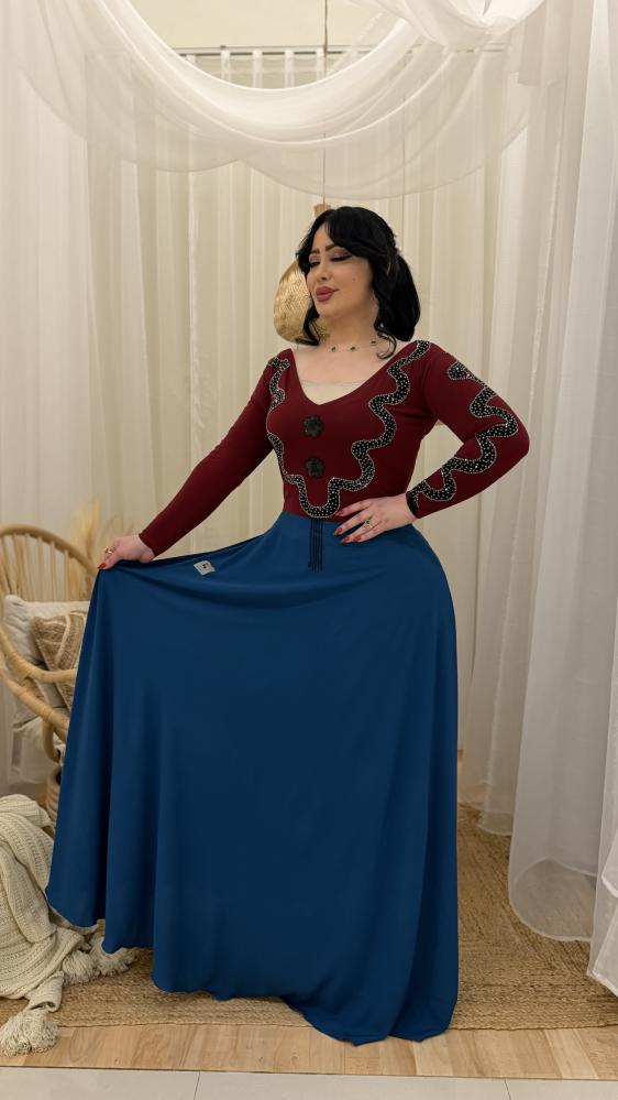 A flowing dress with garnet crystal