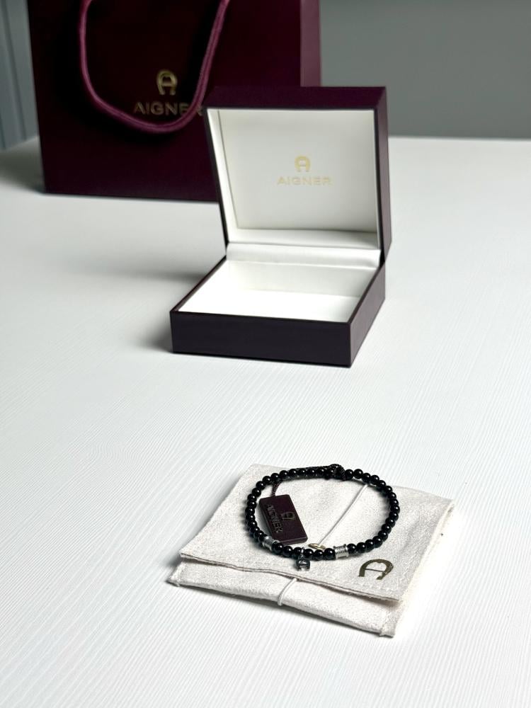 اسوار اجنر المميز اليومي روقيرو اسود بتفاصيل فضيه Ruggero Aigner men bracelet black