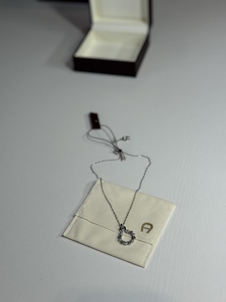 سلسلة اجنر باللون الفضي مرصعة باحجار سوارفسكي Aigner silver necklace with Swarovski crystal's