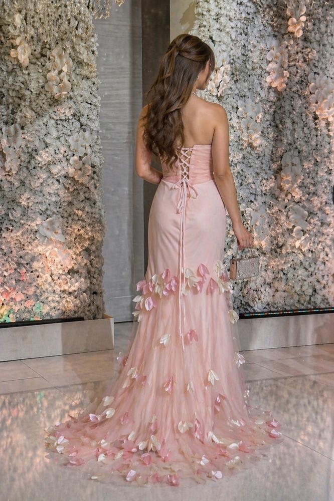 Pink evening dress with floral pattern and soft petal details