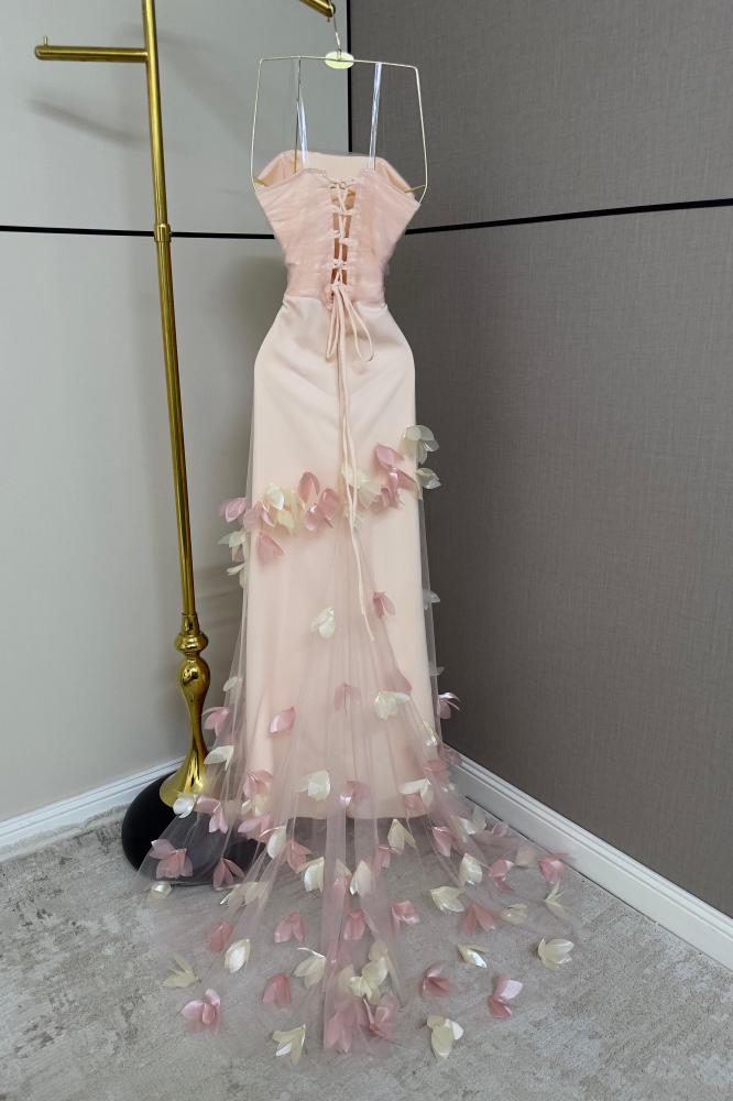 Pink evening dress with floral pattern and soft petal details