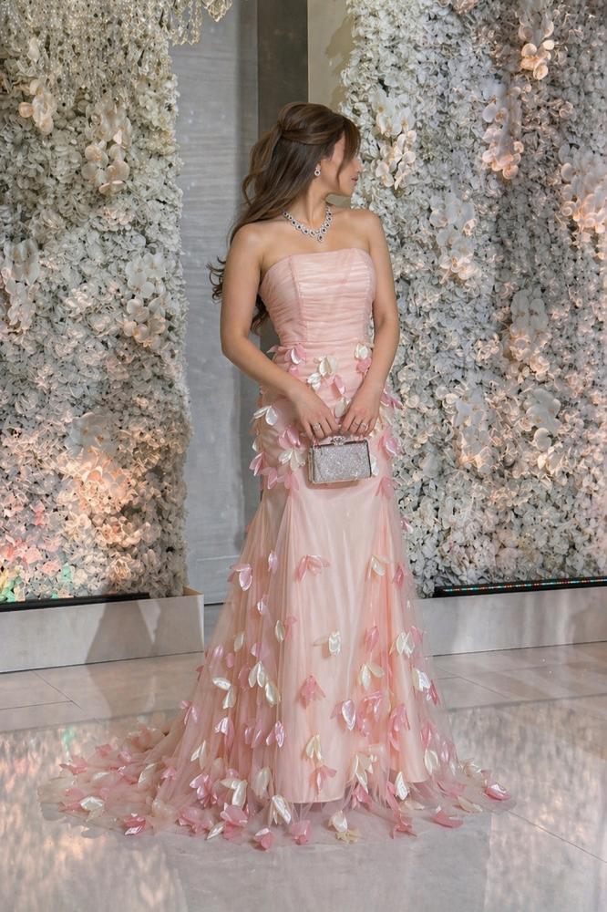 Pink evening dress with floral pattern and soft petal details