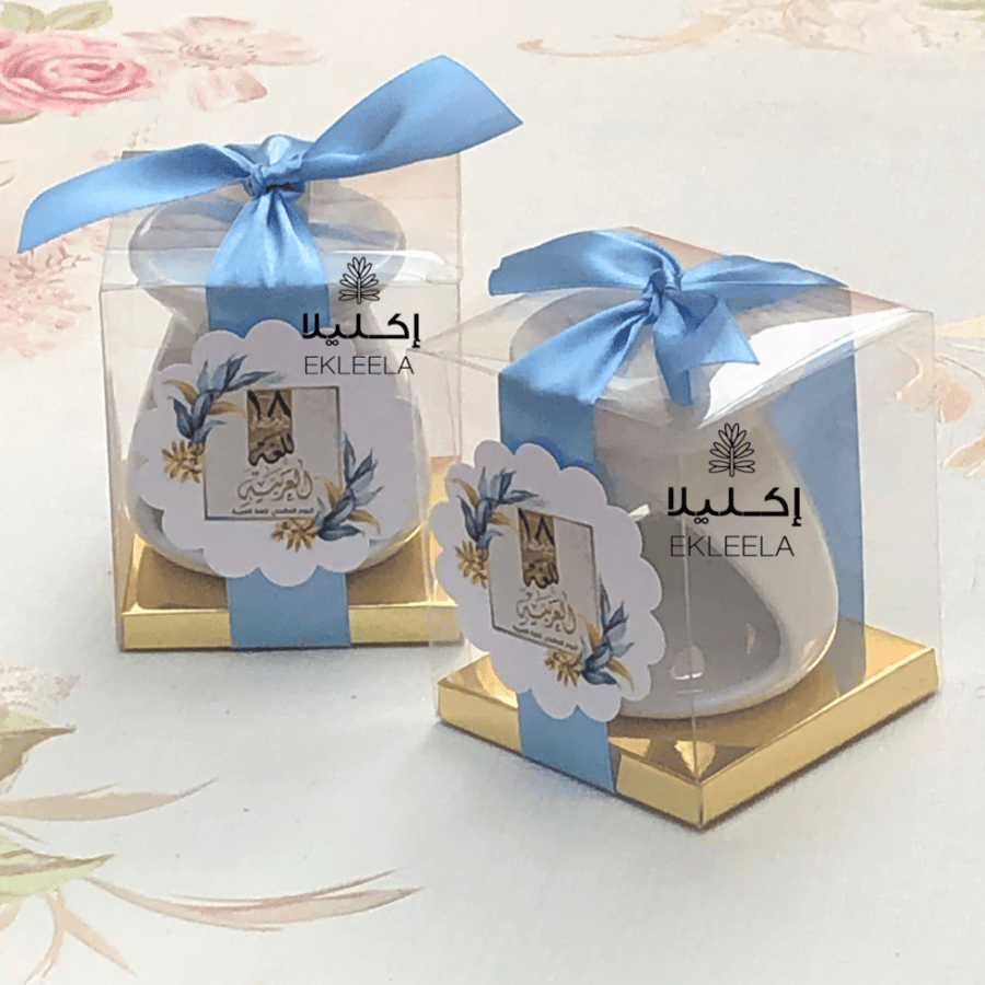 علب توزيعات شفافه مع ميني فواحه حجم صغير مع ثيم اليوم العالمي للغه العربيه  ( 12 علبه )