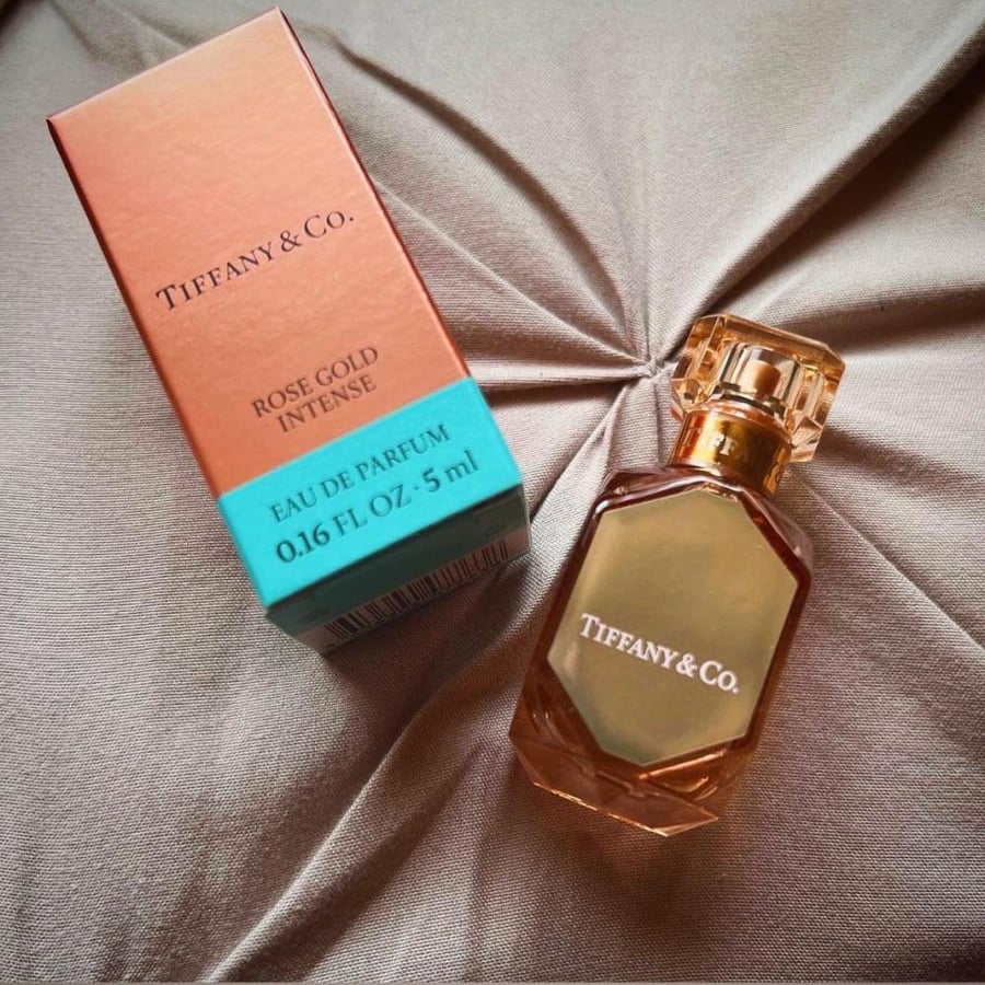 5 Tiffany boxes containing Tiffany perfume and a piece of chocolate