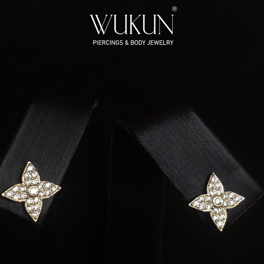 Gold earrings 18k karat in the shape of a flower blossom