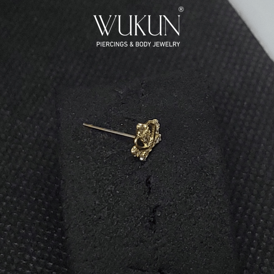 18k gold piercing ring with crown shape and stones