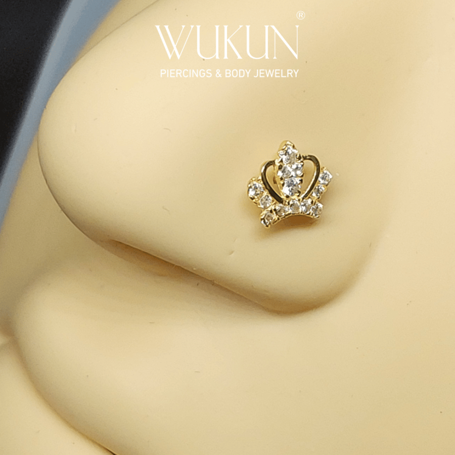18k gold piercing ring with crown shape and stones
