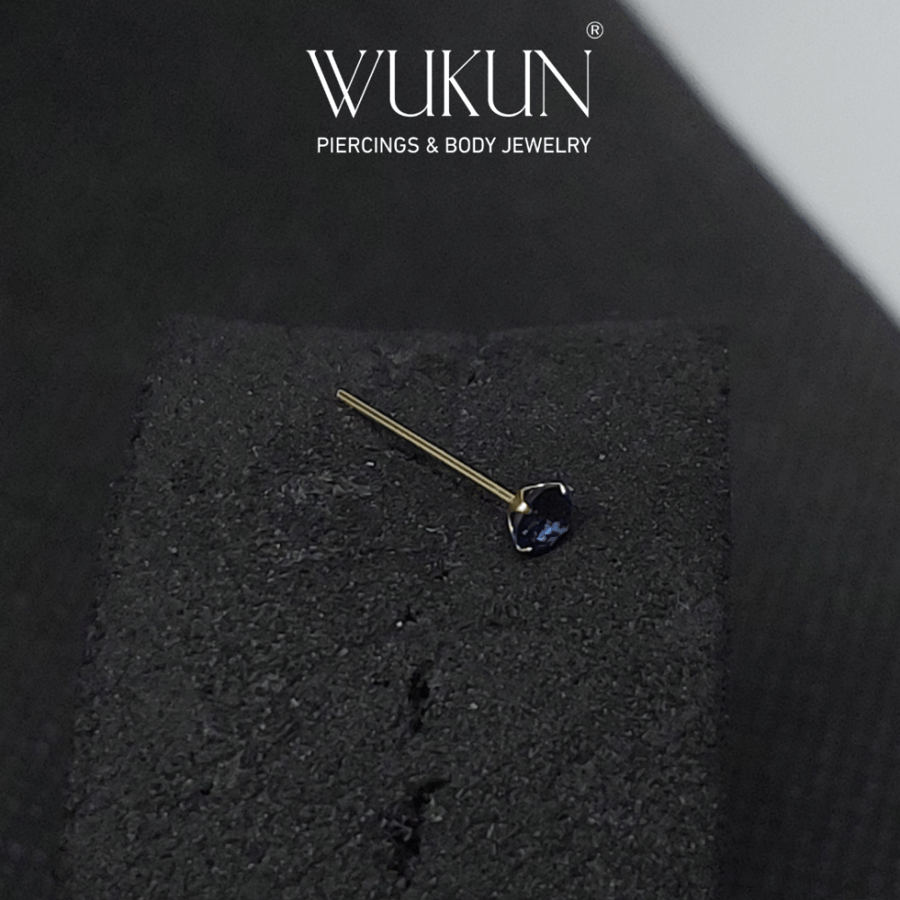 18K gold piercing chain with a central blue stone