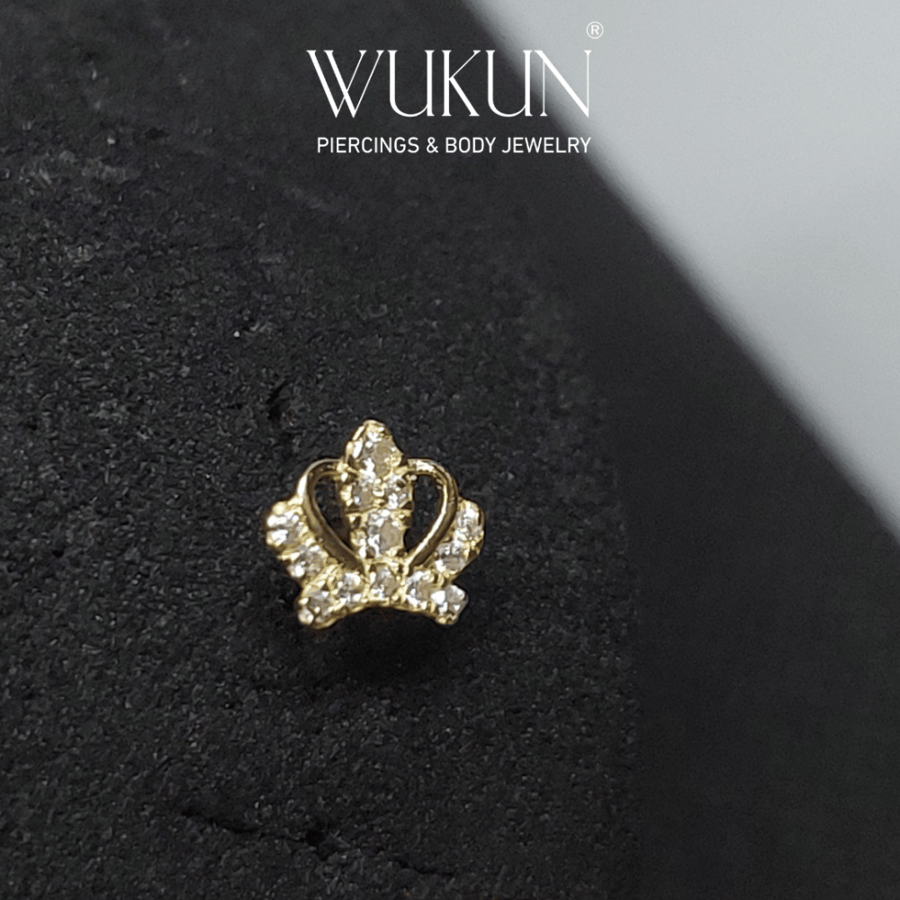 18k gold piercing ring with crown shape and stones