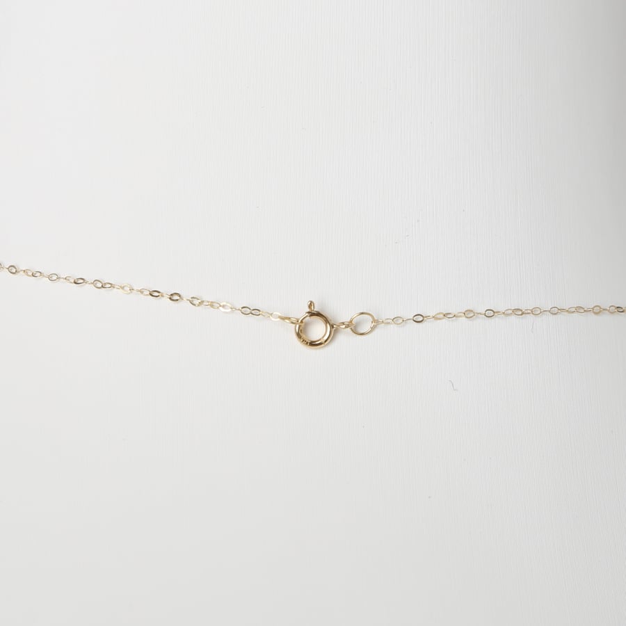 Gold necklace 18 karat diamond design, weight 0.98 grams