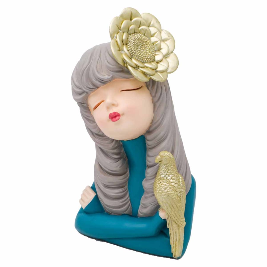 A sculpture of a girl with a falcon, height 23 cm