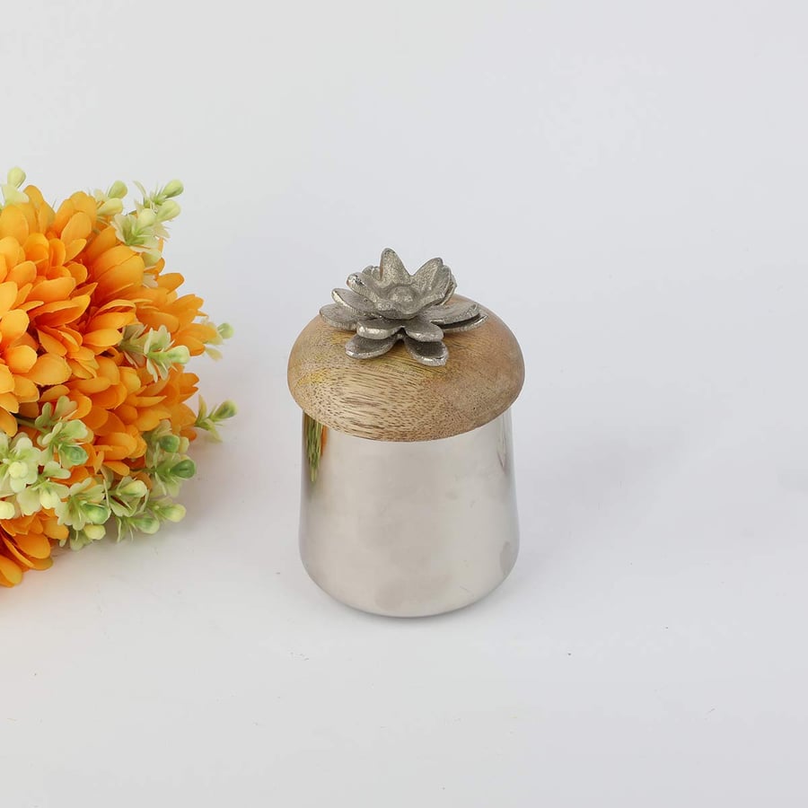 A silver Indian metal box with a wooden lid, rose-shaped handle