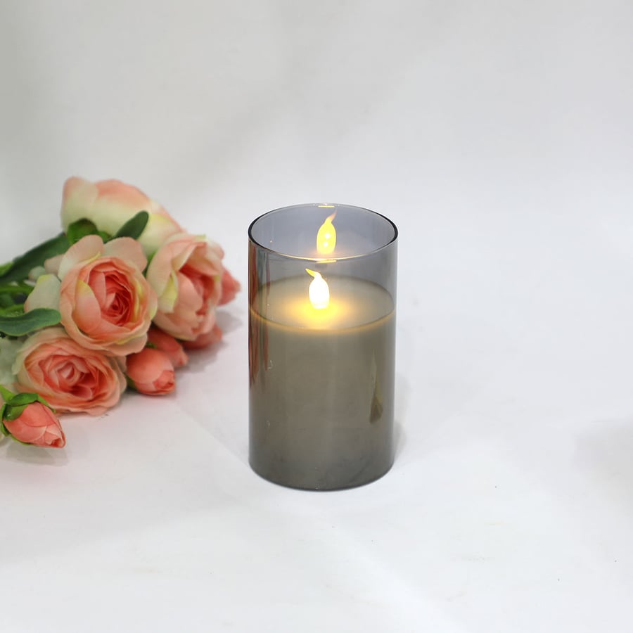 A luminous candle with battery in glass, size 13cm