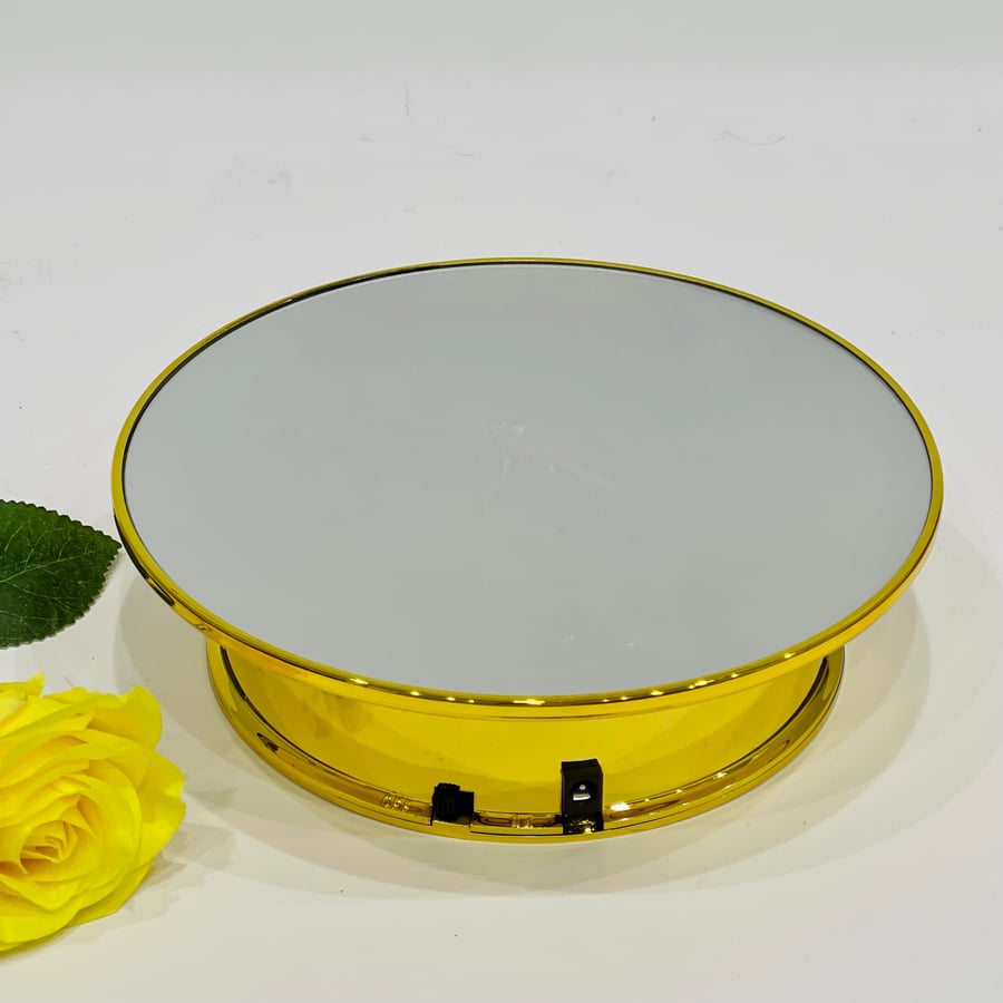 A movable stand powered by USB charging or batteries, gold color, 25 cm size