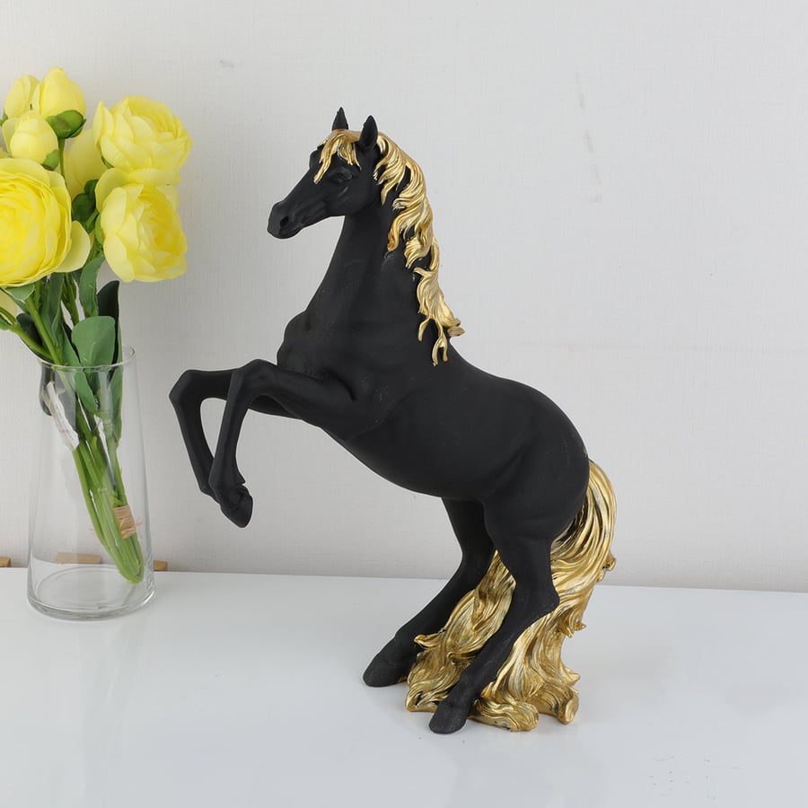A masterpiece in the shape of a horse in black with gold, height 30 cm