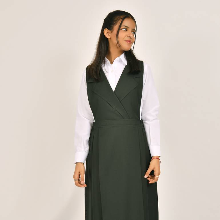 Olive green apron with a blazer collar and pleats on the sides