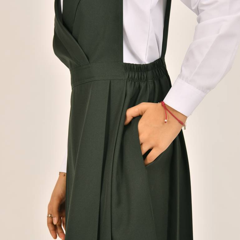 Olive green apron with a blazer collar and pleats on the sides