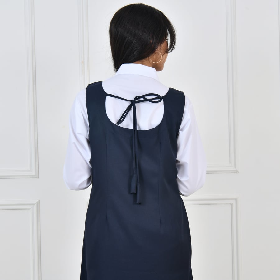 Navy blue apron with a tie closure at the back