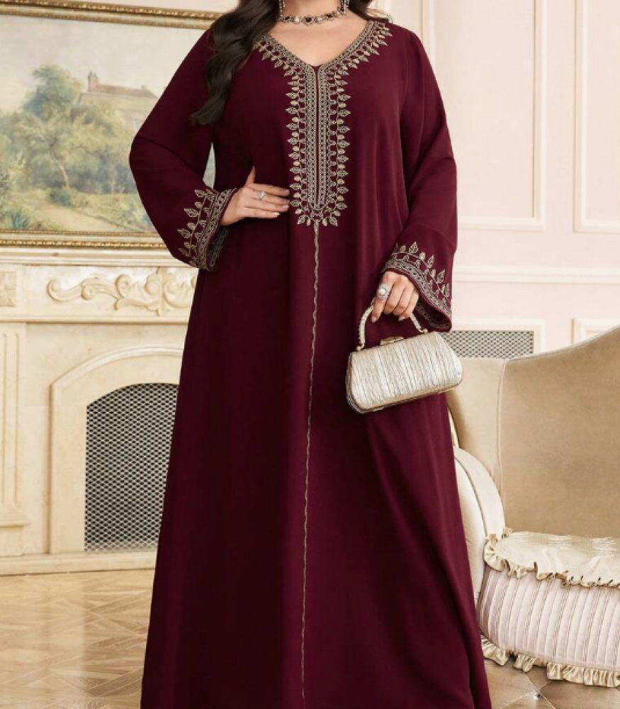 Loose embroidered cotton shirt with elegant details and a V-shaped collar