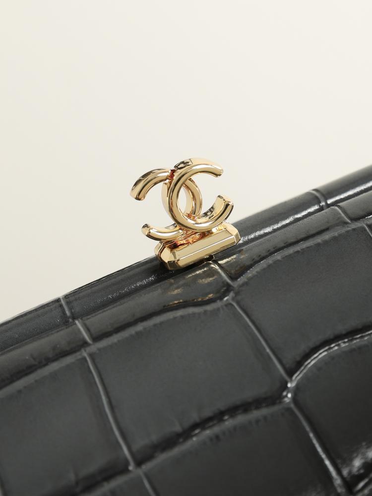CHANEL Clutch with Leather Strap