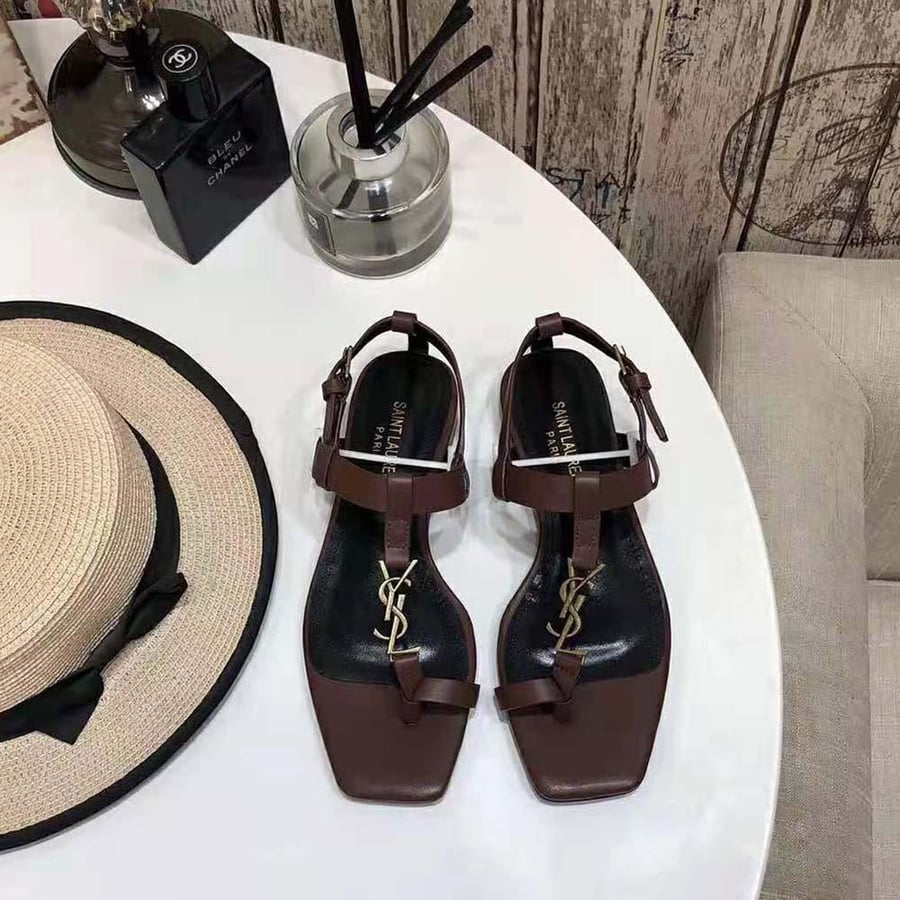 Saint Laurent Cassandra Flat Sandals in Smooth Leather with Gold-Tone Monogram – Brown (Woman)