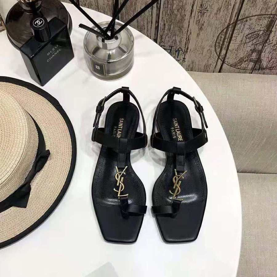 Saint Laurent Cassandra Flat Sandals in Smooth Leather with Gold-tone Monogram – Black (Woman)