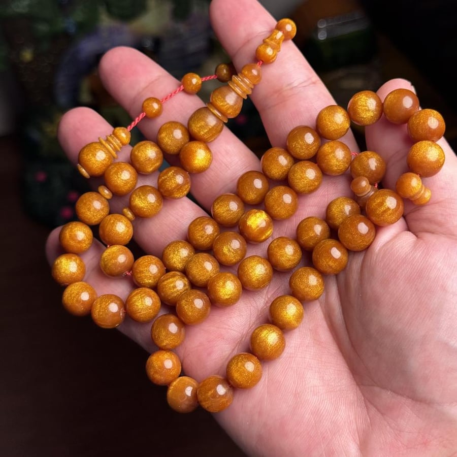 مسباح ذهبي مع تنجيم