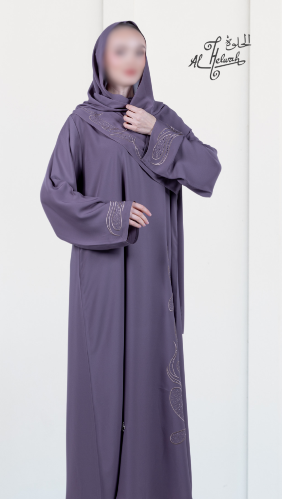 A closed abaya made of colorful embroidered Nada fabric.