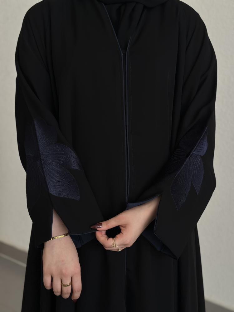 Everyday abaya with padded sleeves and embroidery in navy blue.