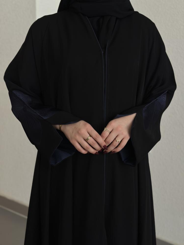 Everyday abaya with padded sleeves and embroidery in navy blue.